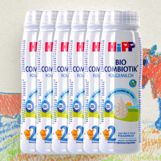 Multiple containers of HiPP Bio Combiotik Folgemilch on a colorful background