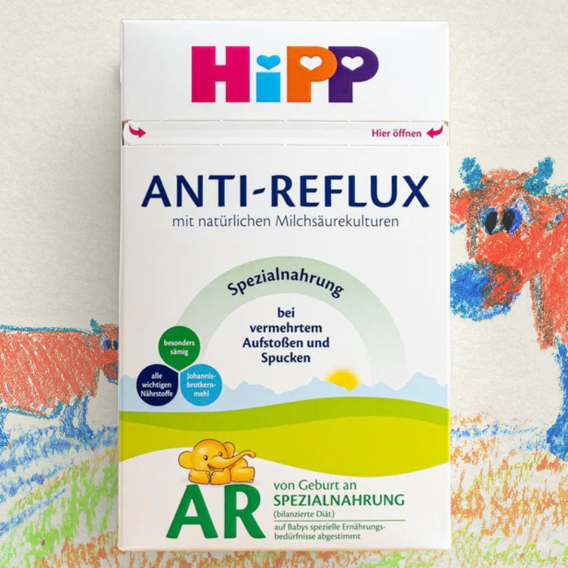 Hipp Anti-Reflux baby formula packaging on a colorful background