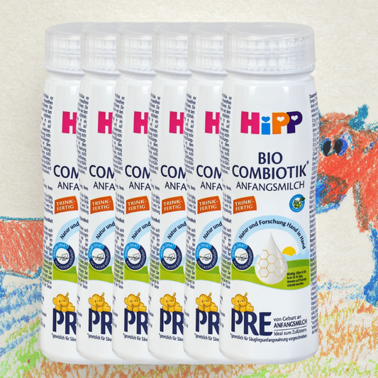 Multiple containers of HiPP baby formula on a colorful background