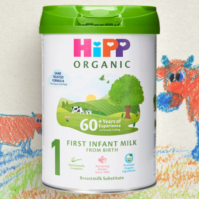 Hipp Organic First Infant Milk container with a colorful background