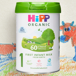 Hipp Organic First Infant Milk container with a colorful background