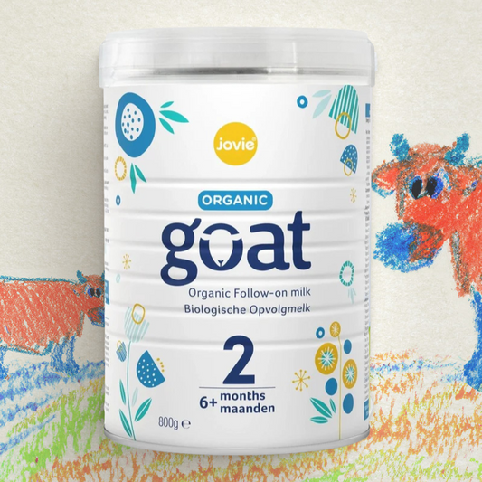 Jovie Organic Goat milk powder container with colorful cow illustrations in the background